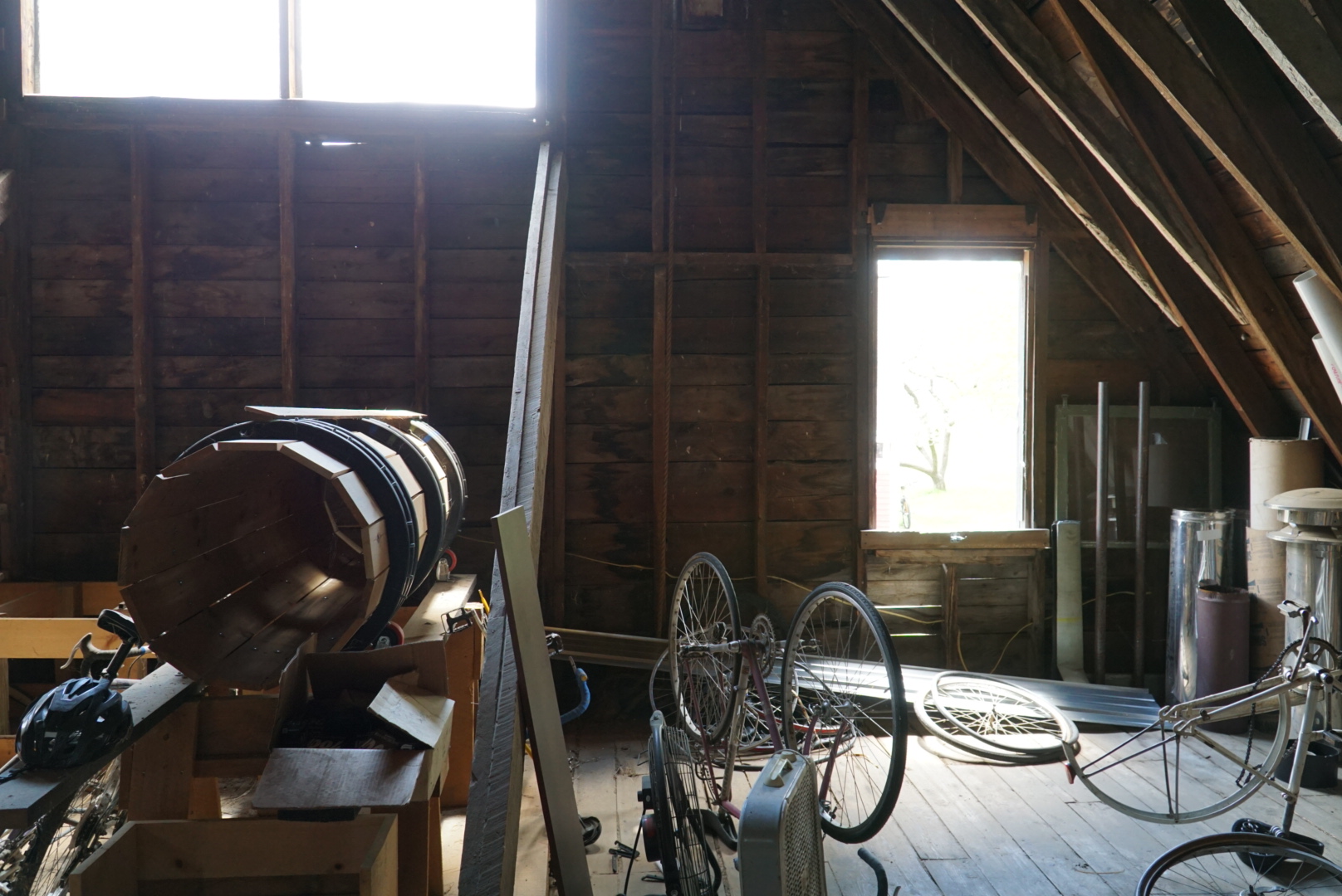 An image of a bicycle in an attic.